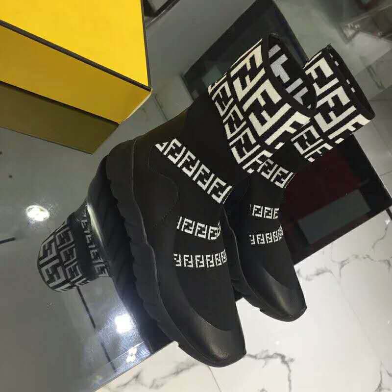 Close-up on Fendi branding on heel tab of black high-tops