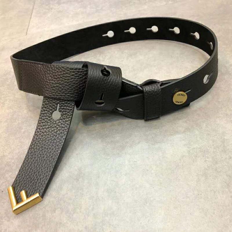 Close-up of Fendi Women Long Tie Belt black leather and gold F-shaped tip