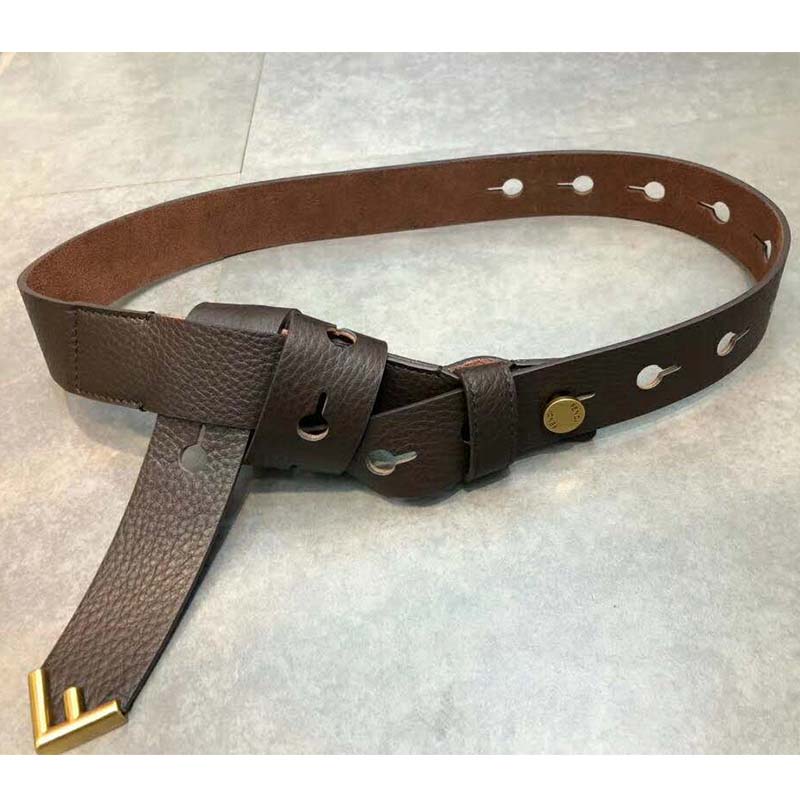 Close-up of gold F-shaped tip on Fendi Women Long Tie Belt