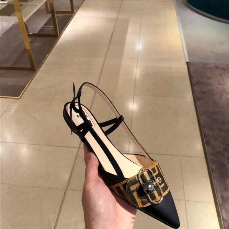Close-up of brown leather and gold hardware on Fendi Women Shoes Black Leather Slingbacks