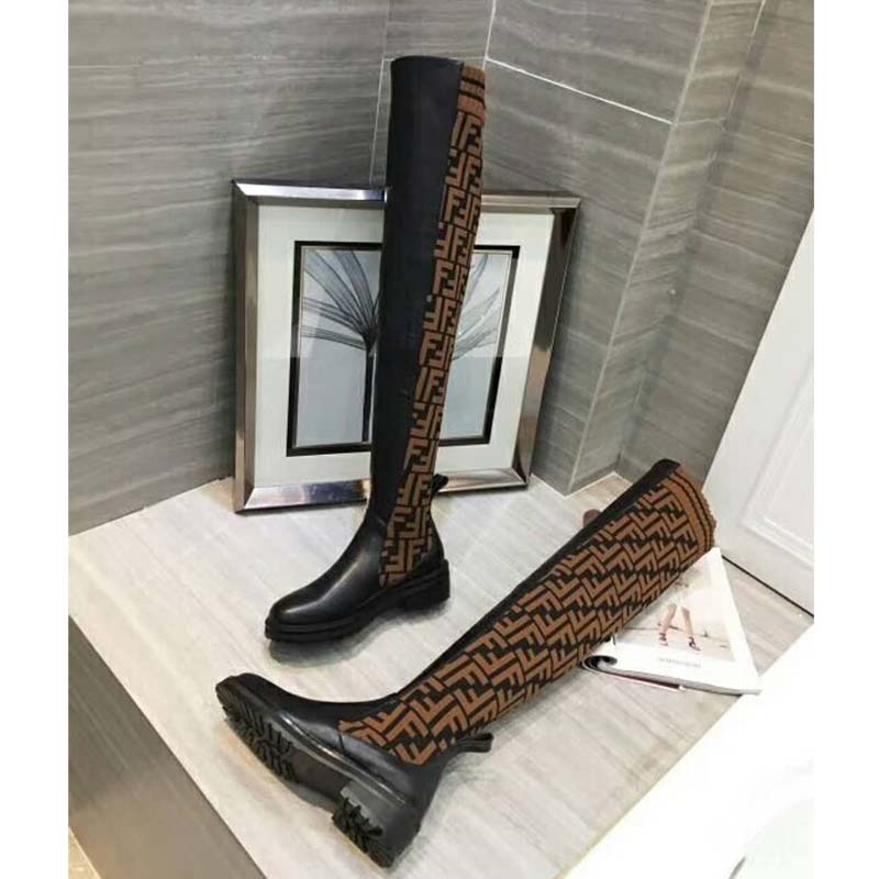 Side angle showing silhouette and zipper on Fendi Women Shoes Black Leather Thigh-High Boots
