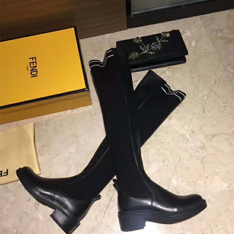 Close-up detail of Fendi logo hardware on Black Nappa Cuissard Boots