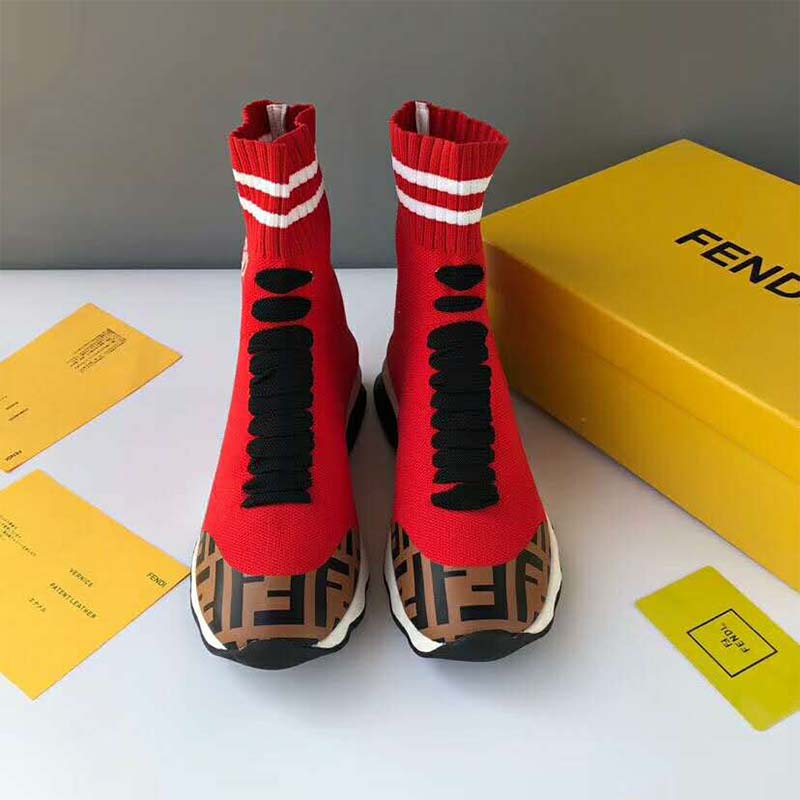Close-up detail of red fabric and embossed Fendi logo hardware