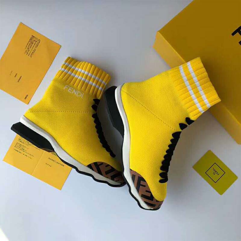 Close-up of lace closure and yellow fabric on Fendi sneaker boots