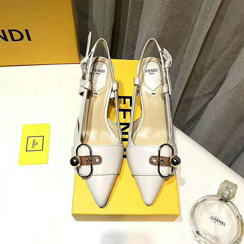 Close-up of gold-tone hardware on Fendi White Leather Slingbacks