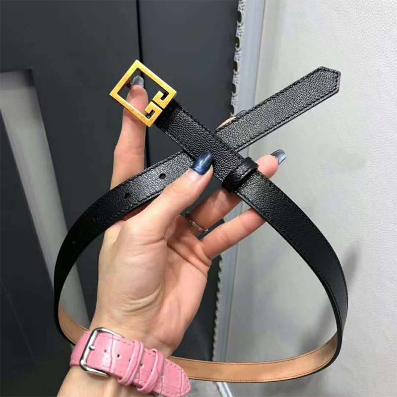 Close-up of polished silver double G buckle on Givenchy belt