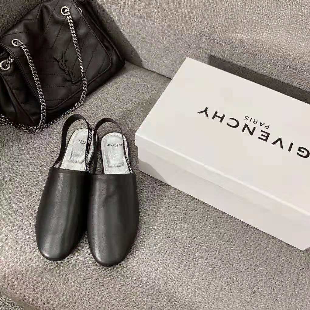 Close-up of black leather and Givenchy logo hardware detail