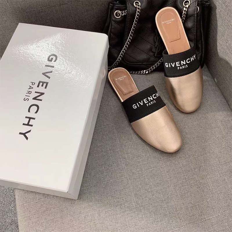 Close-up of gold leather and Givenchy branding on Givenchy Paris Leather Mules-Gold