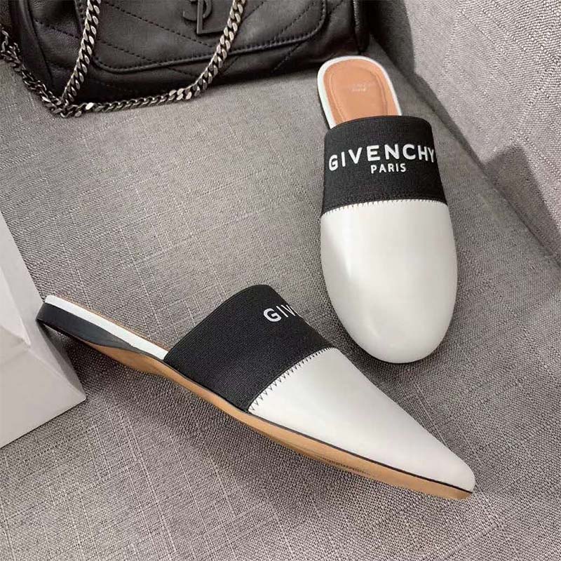 Close-up of white leather and embossed logo on Givenchy Paris Leather Mules