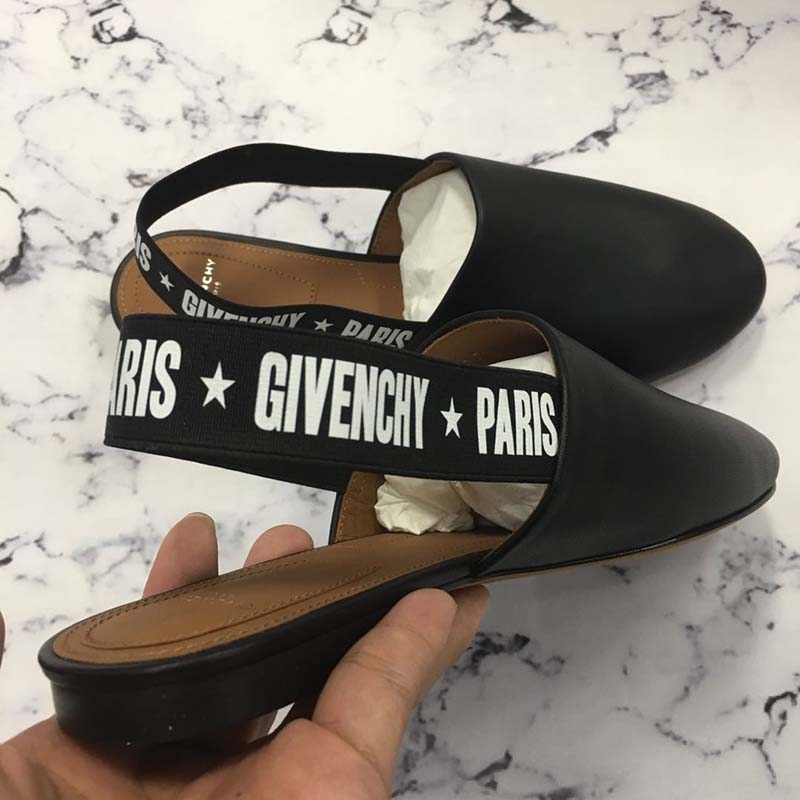 Rear angle showing slingback and leather detail on Givenchy stars flat mules
