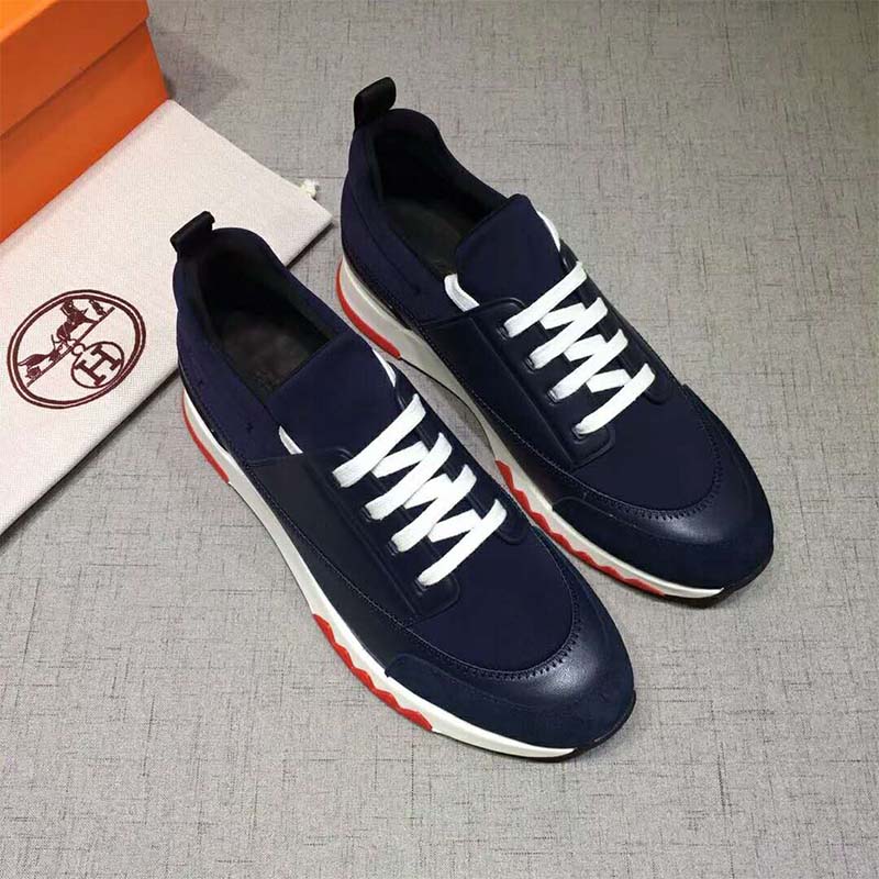 Close-up of blue calfskin leather and Hermes embossed logo on sneaker