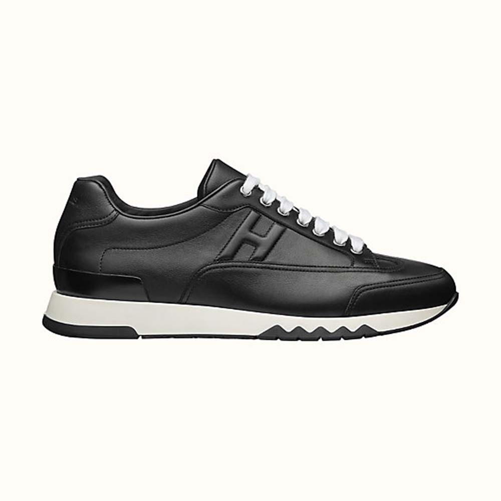 Side view of Hermes Men Trail sneaker in Calfskin-Black showing silhouette