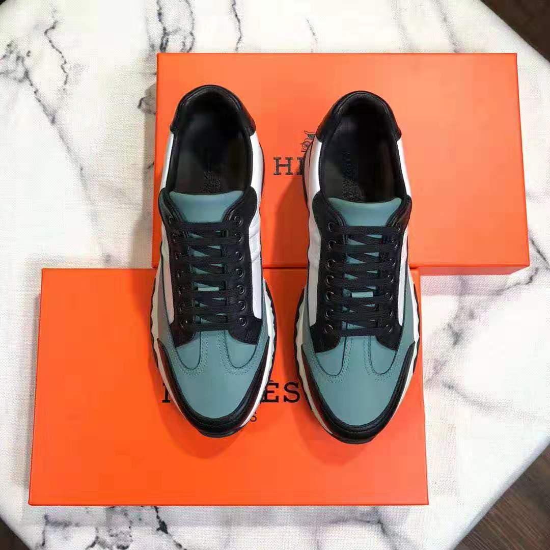 Close-up of blue calfskin leather and embossed detail on Hermes Men Trail sneaker