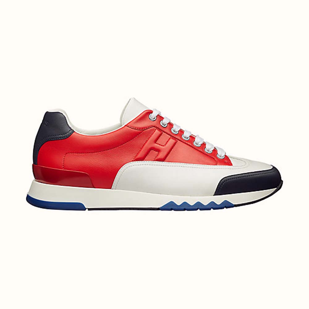 Side profile of Hermes Men Trail sneaker in Calfskin-Red showing silhouette