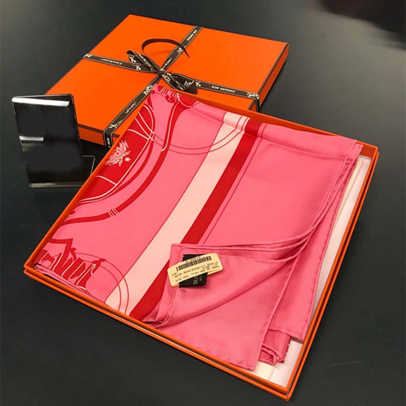 Close-up of pink silk fabric and hand-rolled edges on Hermes scarf