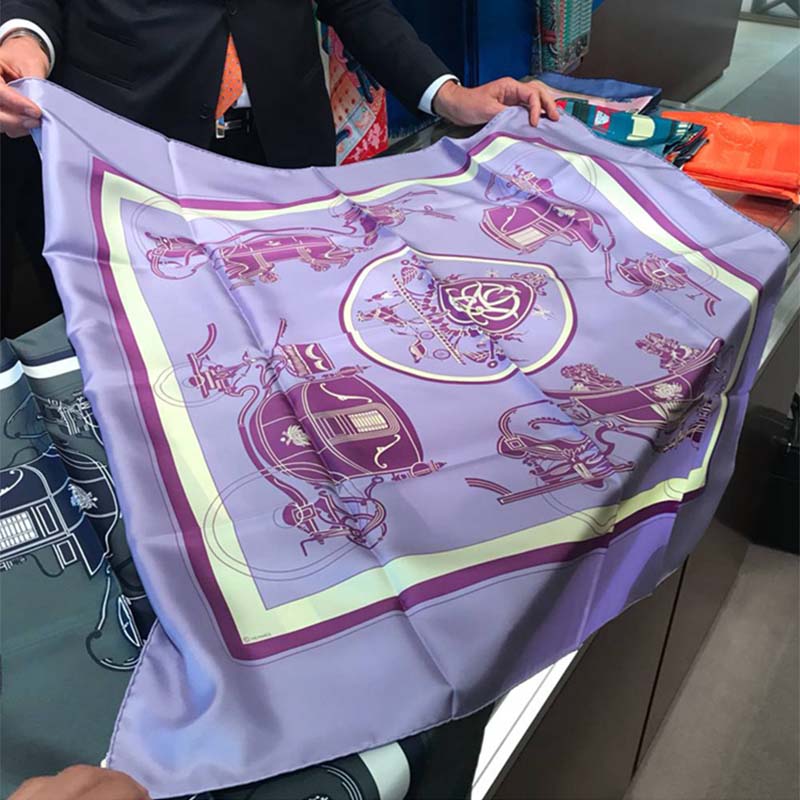 Side view of Hermes Women Ex-Libris Scarf 90-Purple draped elegantly