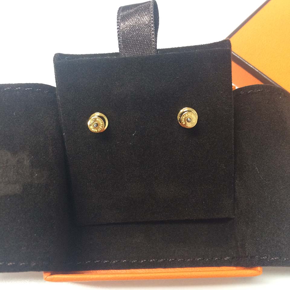 Side profile of Hermes Women Pop H Earrings Jewelry White highlighting silhouette