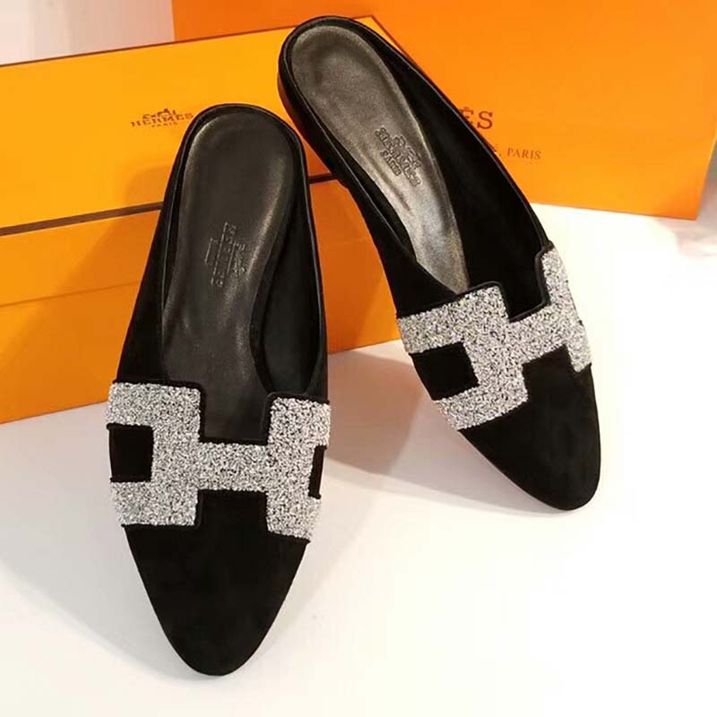 Close-up of Hermes Women Roxane Mule Shoes Black metallic hardware detail
