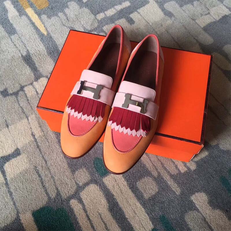 Close-up of orange leather and silver hardware on Hermes Women Shoes Royal Loafer-Pink