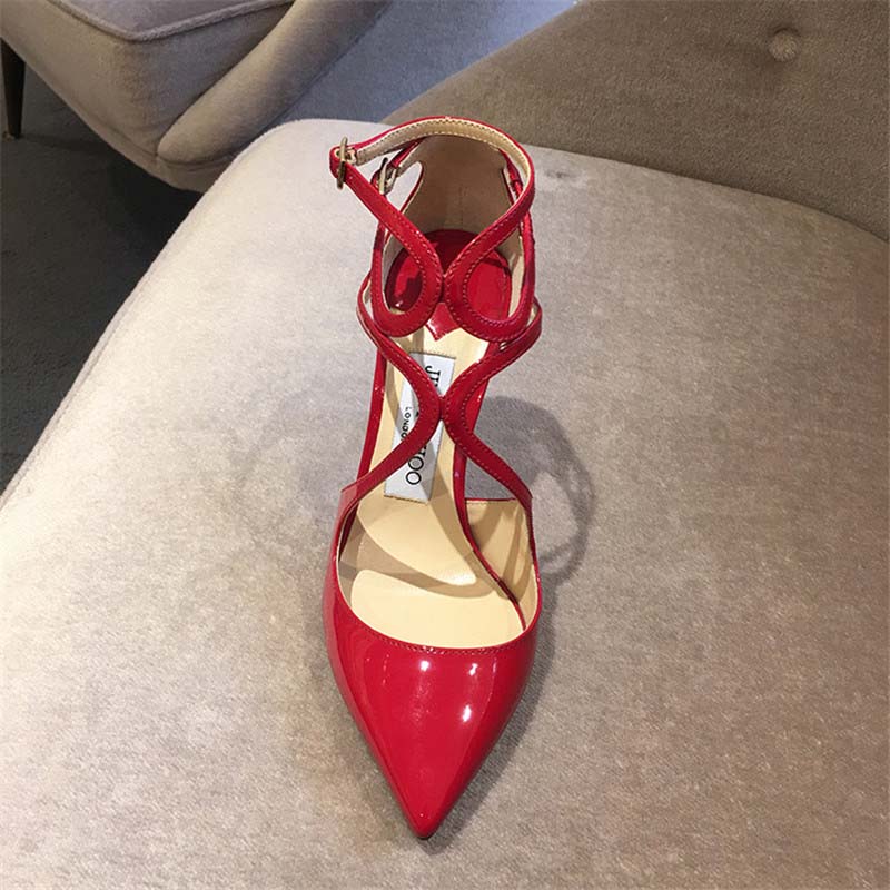 Close-up on pointed toe and glossy patent leather of Jimmy Choo Lancer 110 pumps