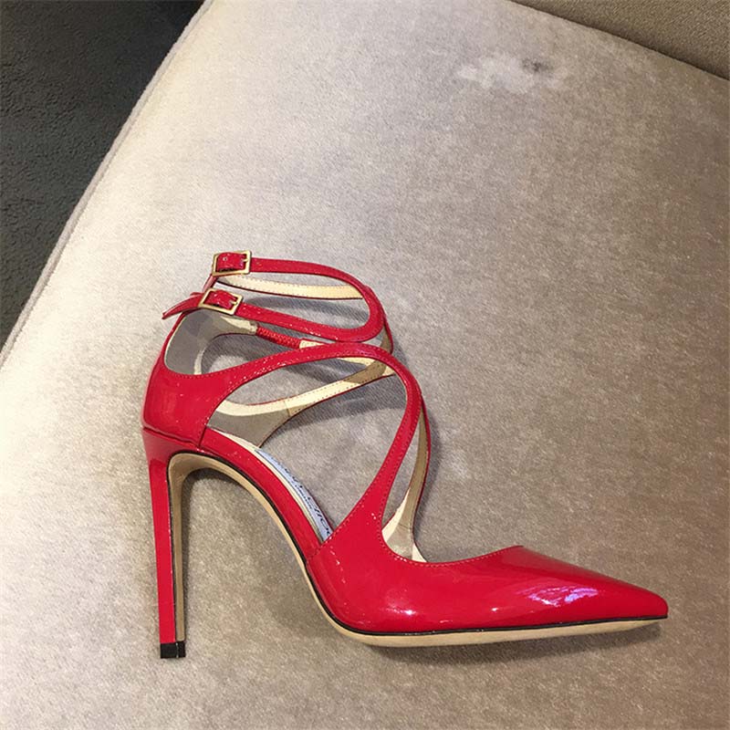 Rear angle focusing on 110mm heel and signature detail of Jimmy Choo red pumps