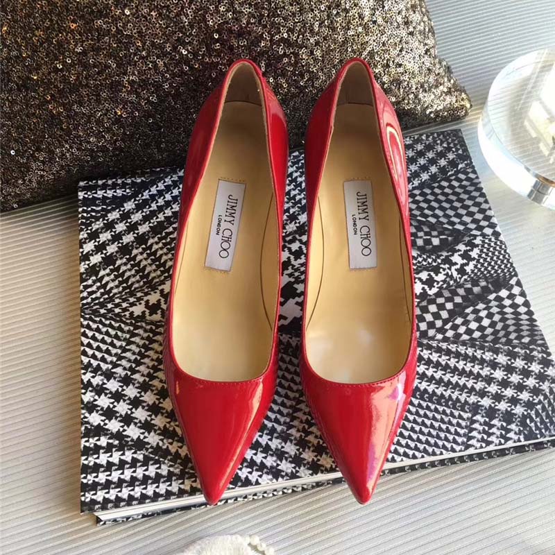 Close-up of glossy red patent leather on Jimmy Choo Romy 85 pumps