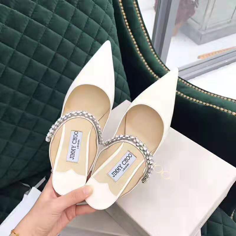 Close-up of crystal strap detail on Jimmy Choo Bing 65 white mules