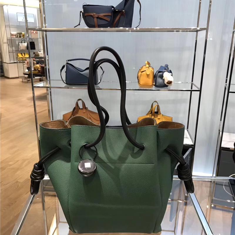 Close-up on signature Flamenco Knot closure on Loewe small tote
