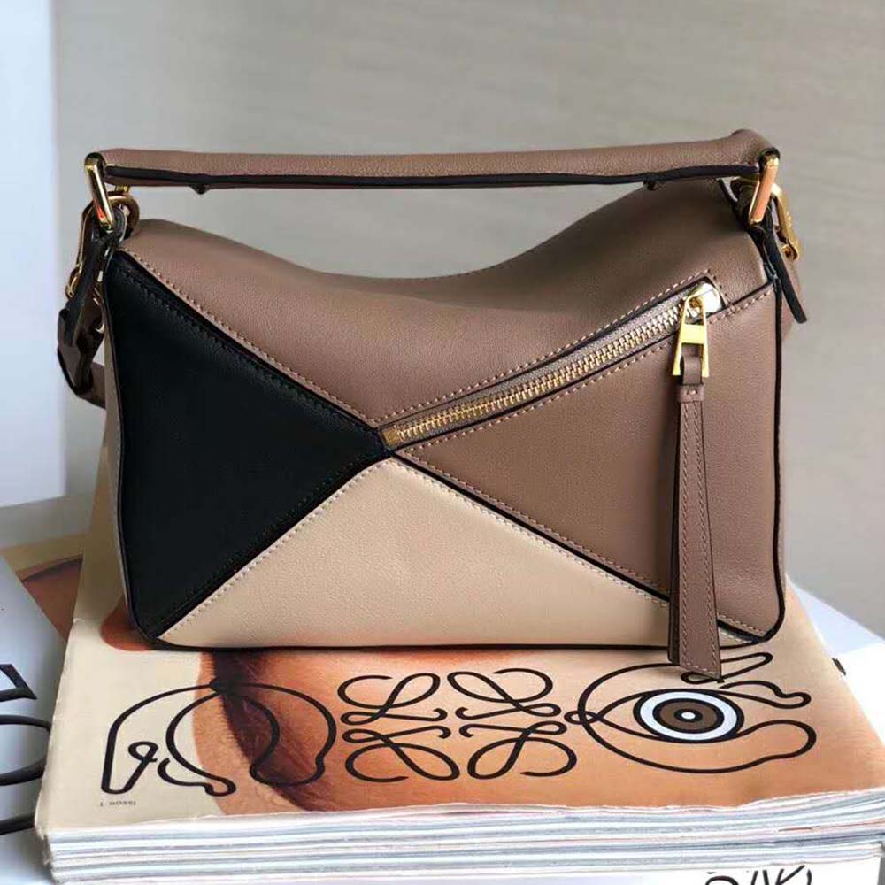 Side angle of Loewe Women Puzzle Bag Amber Light Oat with adjustable strap