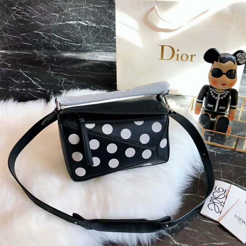 Close-up of leather texture and metal hardware on Loewe Women Puzzle Dots Bag Black/Greige