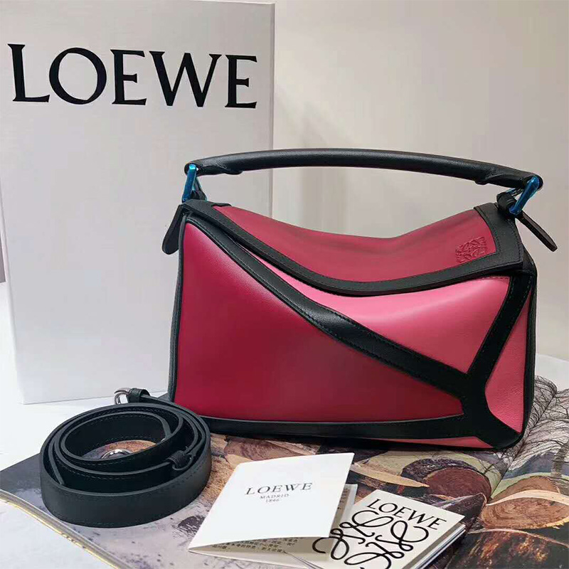 Close-up of leather texture and gold-tone hardware on Loewe Puzzle Small Bag