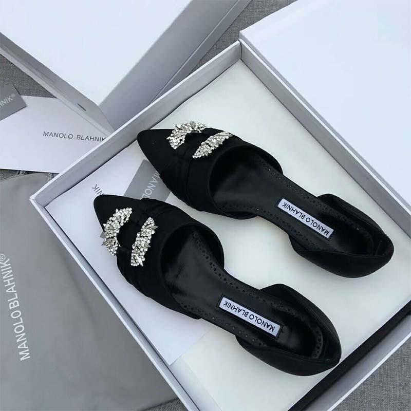 Top view showing elegant D’Orsay cut of Manolo Blahnik Luanda flats in black satin