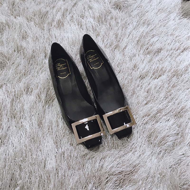 Close-up detail of signature buckle on Roger Vivier Belle Vivier Trompette Pumps