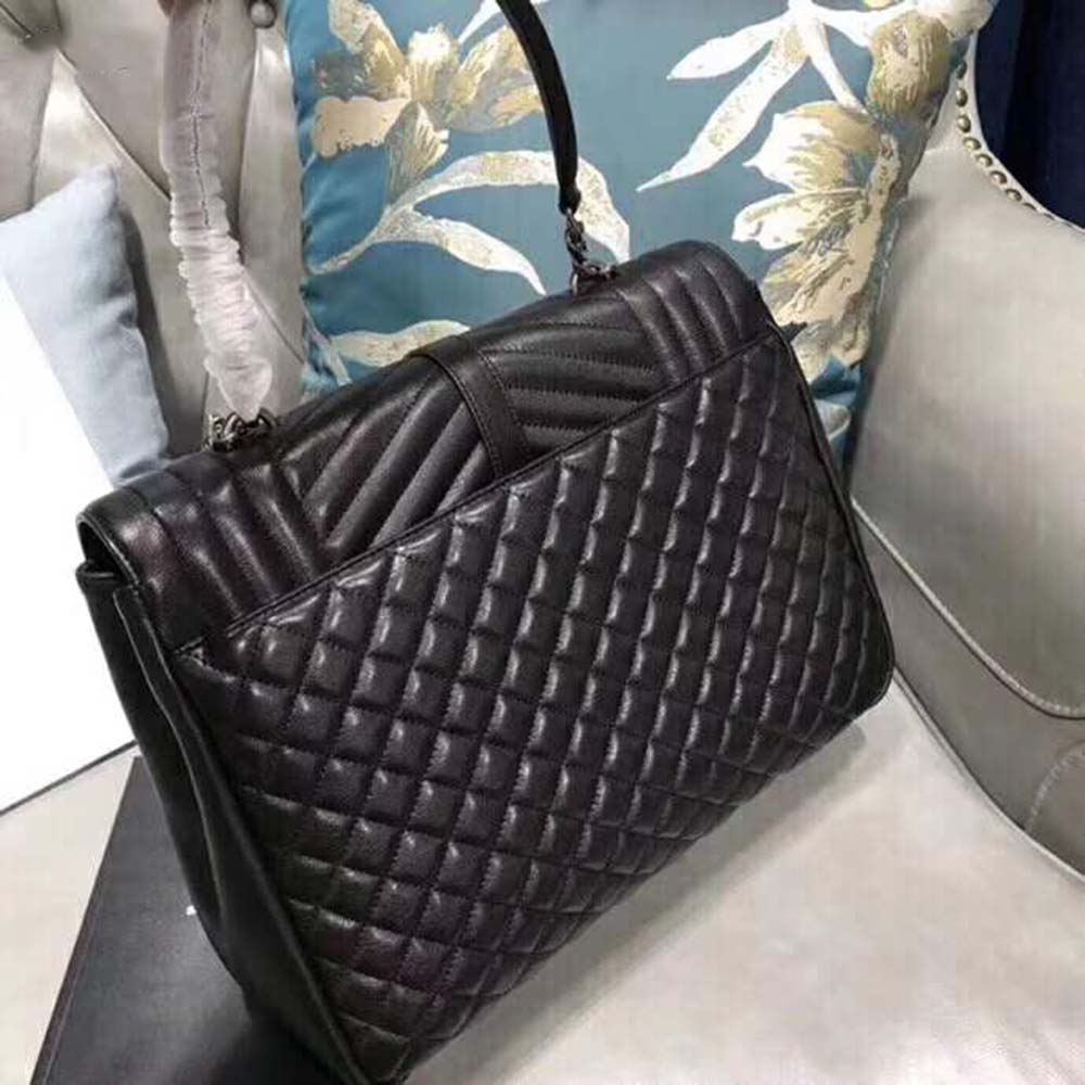 Side angle showing mixed grain leather texture on Saint Laurent YSL Large Envelope bag