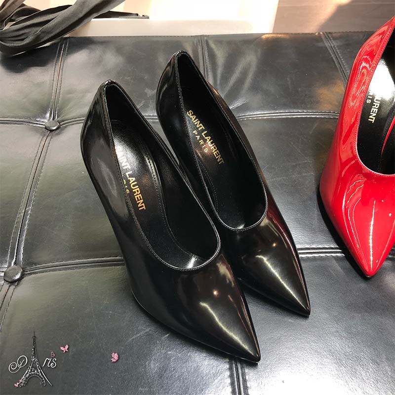 Close-up of YSL logo hardware on Teddy Pump shiny leather heel