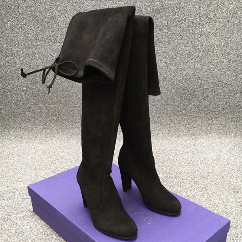 Close-up of black suede and lace-up detail on The Tieland Boot