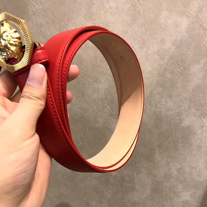 Side angle showing leather texture and gold buckle of Versace belt