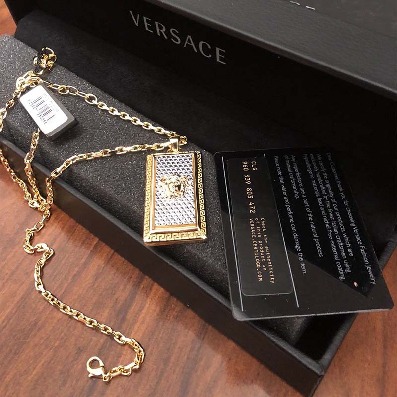 Close-up of Medusa pendant detail on Versace Unisex Rectangle Necklace