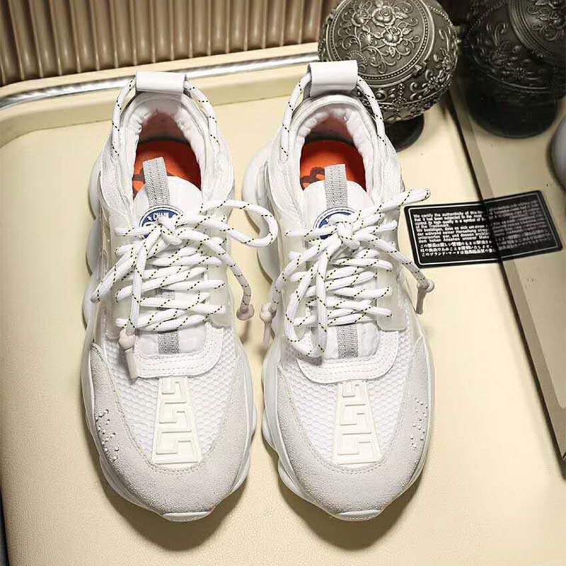 Overhead shot showing laces and leather texture on Versace white sneakers
