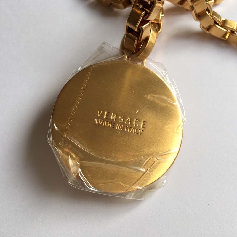 Side angle showing gold chain and clasp of Versace Unisex Single Medusa Necklace