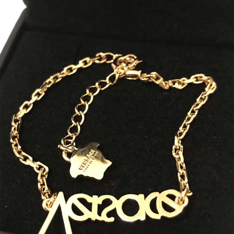 Side view of Versace Unisex Vintage Versace Logo Bracelet clasp and texture