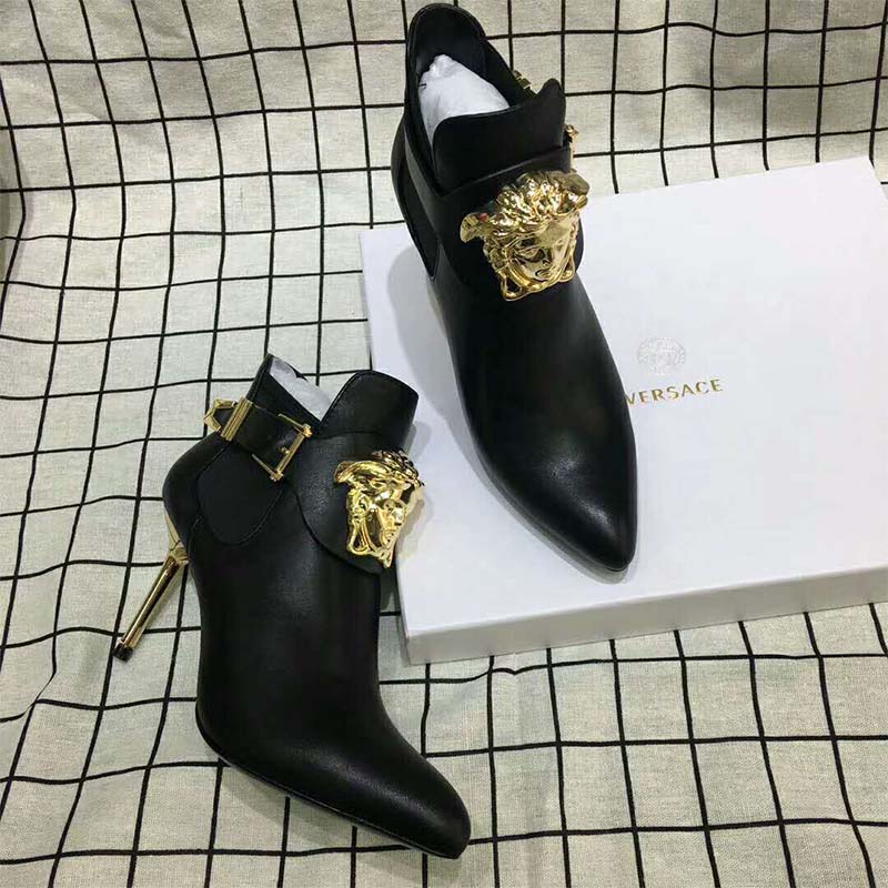 Close-up of gold Medusa emblem on Versace Women Shoes Palazzo High heel Booties-95mm
