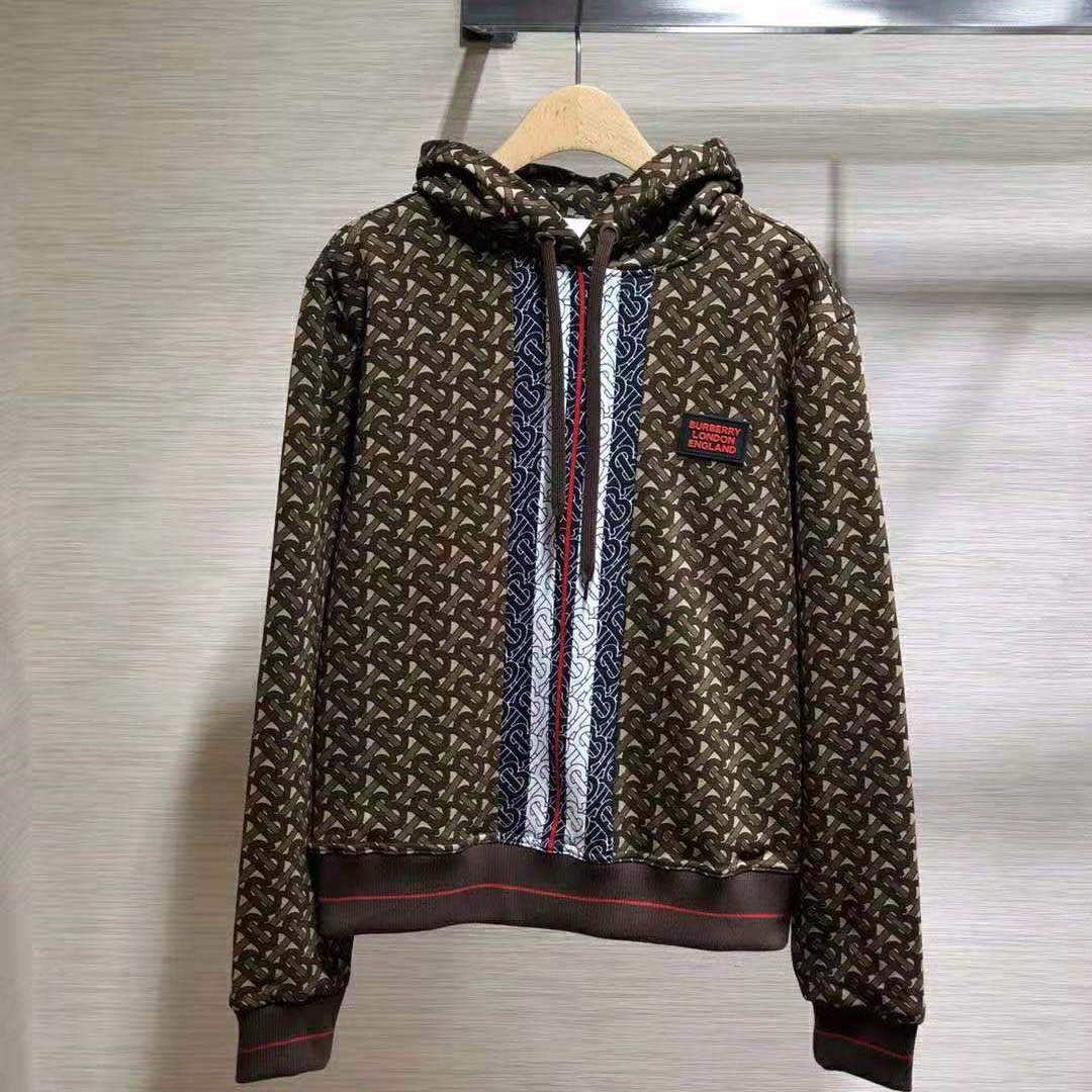 Close-up of Burberry signature monogram stripe on brown cotton hoodie