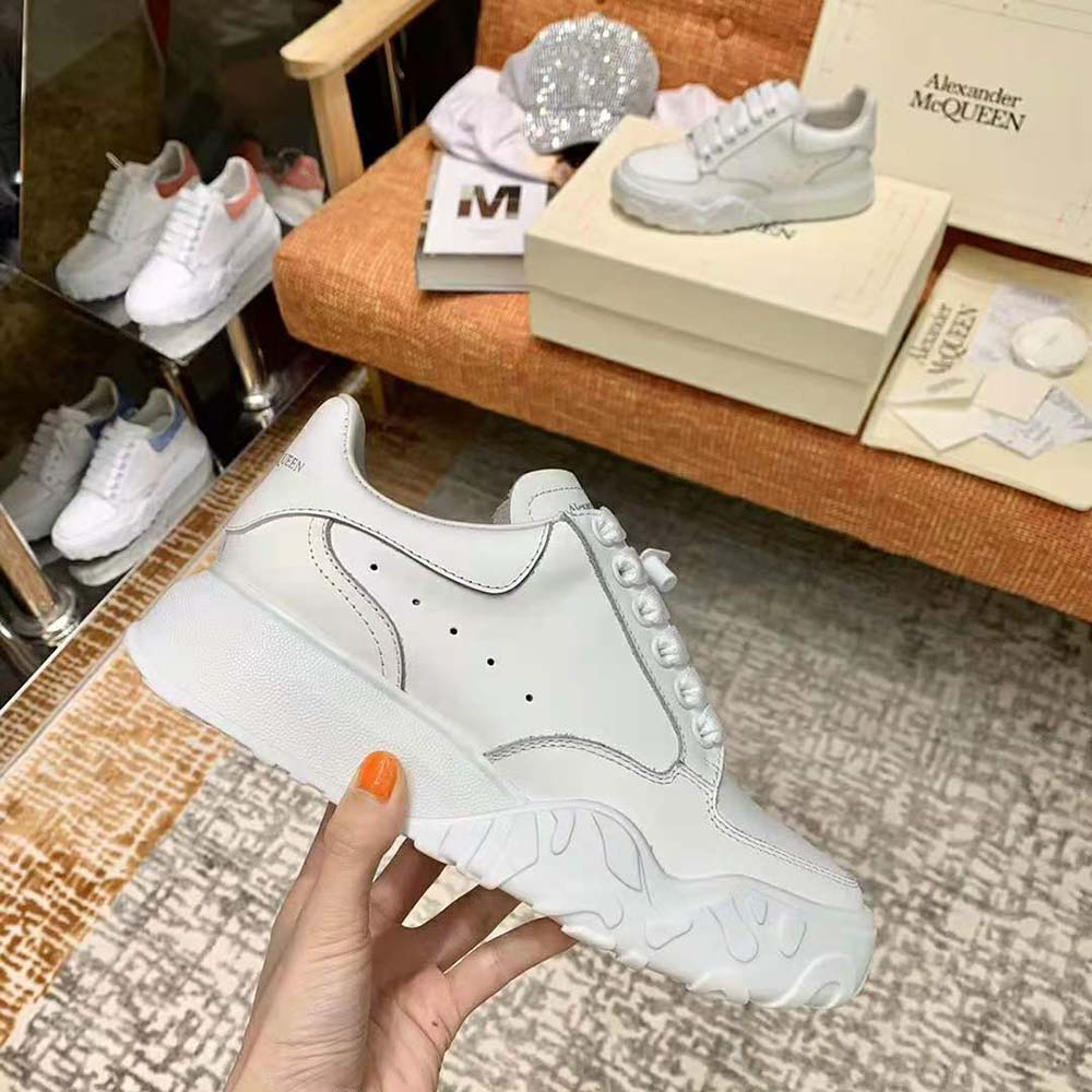 Side profile showing lace closure of Alexander Mcqueen Women Court Trainer-White
