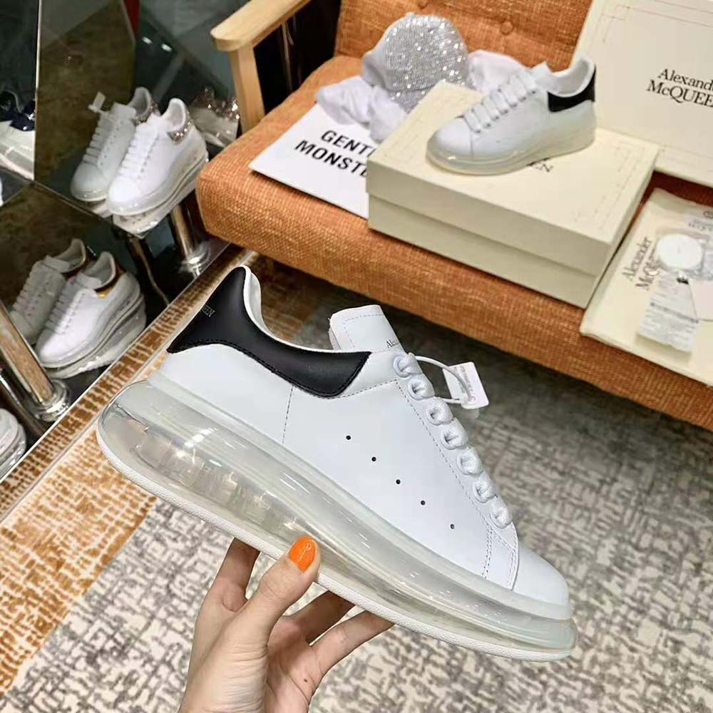 Top angle of Alexander Mcqueen Women Oversized Sneaker-Black highlighting lace closure detail