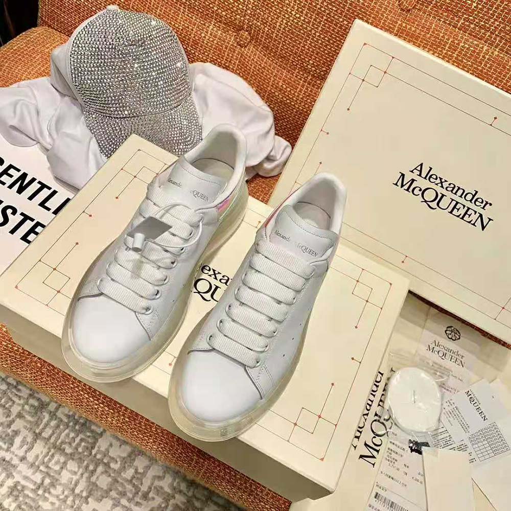 Close-up on embossed logo and oversized sole of Alexander Mcqueen sneaker