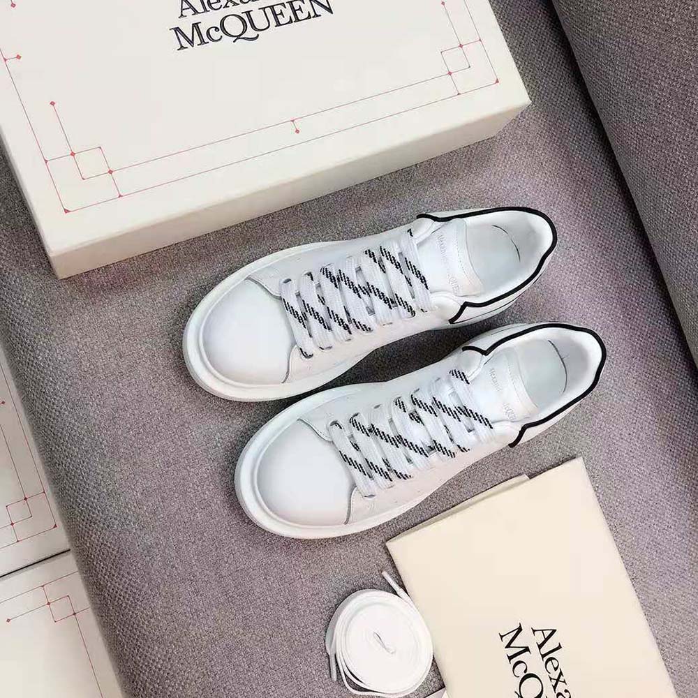 Close-up of lace and embossed logo on Alexander Mcqueen Women Oversized Sneaker