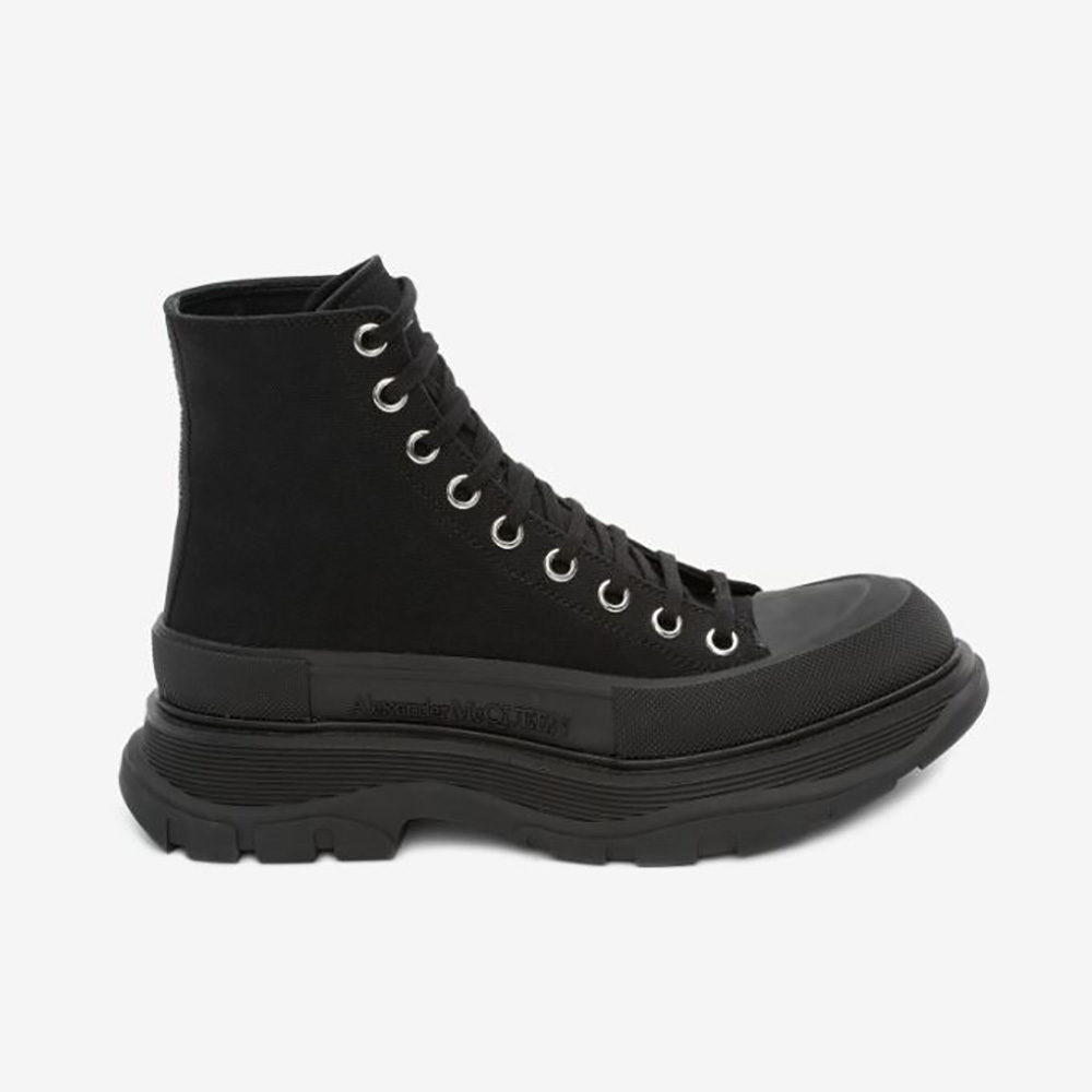 Side angle view of Alexander Mcqueen Women Tread Slick Boot-Black showing tread sole