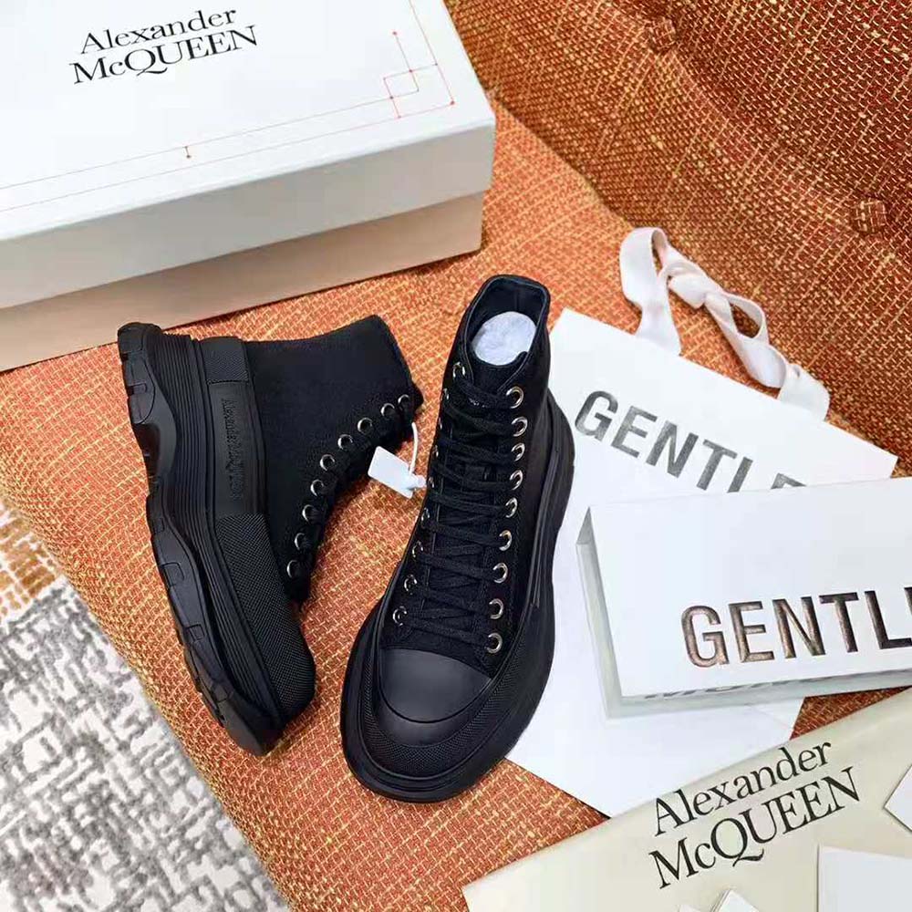 Top-down shot highlighting lace-up closure on Alexander Mcqueen Women Tread Slick Boot-Black