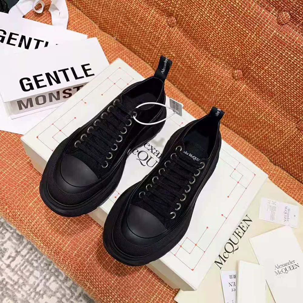Close-up of chunky tread sole on Alexander Mcqueen Women Tread Slick Lace Up-Black